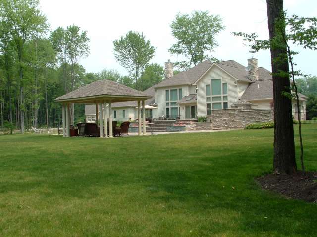 View of Bainbridge Ohio residence from behind house.  The image shows a landscape design done by Douglas Nemeckay.